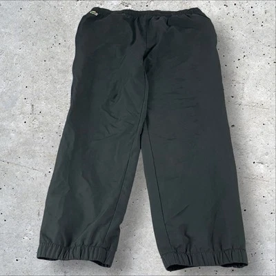Pantalones deportivos vintage Lacoste para hombre 7 negros poliéster cordón cremallera puños F407 Foto 1 de 4