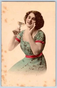1910's RPPC PRETTY WOMAN CHAMPAGNE SAUCER GLASS HANDCOLORED DRESS POSTCARD - Picture 1 of 2