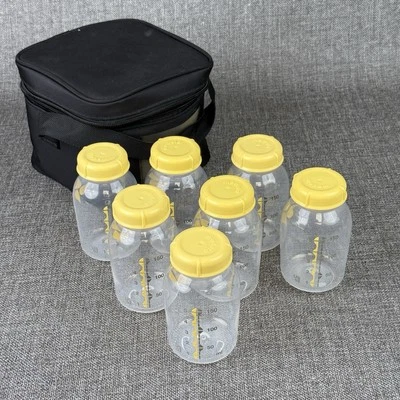 Lote de 7 biberones y tapas de almacenamiento de leche materna Medela de 5 oz/150 ml Foto 1 de 4
