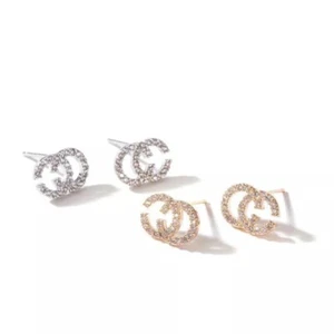 Orecchini bigiotteria con strass simil ch color oro o argento - Foto 1 di 3