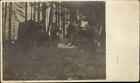 Men eating in the woods trees tent? ~ RPPC real photo CYKO 1904-1920s