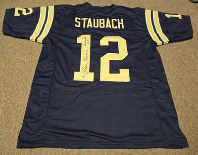 Camiseta deportiva firmada por Roger Staubach Heisman 63 azul marino Beckett auto fútbol universitario Foto 1 de 4