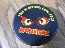Madison Monsters die cut UHL 1998-99 Official Game puck - Lindsay slug