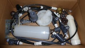 Assorted filter parts, Uv sterilizer, check valve, pressure regulator, and gauge