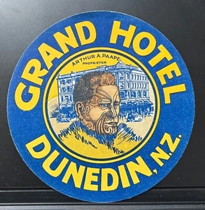 GRAND HOTEL DUNEDIN NUEVA ZELANDA ETIQUETA DE EQUIPAJE HOMBRE MAORÍ TATUAJES EN LA CARA - Imagen 1 de 2