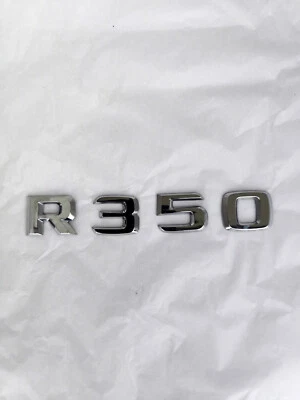 2006-2010 MERCEDES BENZ R350 ЗАДНЯЯ КРЫШКА БАГАЖНИКА ЭМБЛЕМА ЗНАЧОК ЛОГОТИП СИМВОЛ. OEM - Изображение 1 из 3