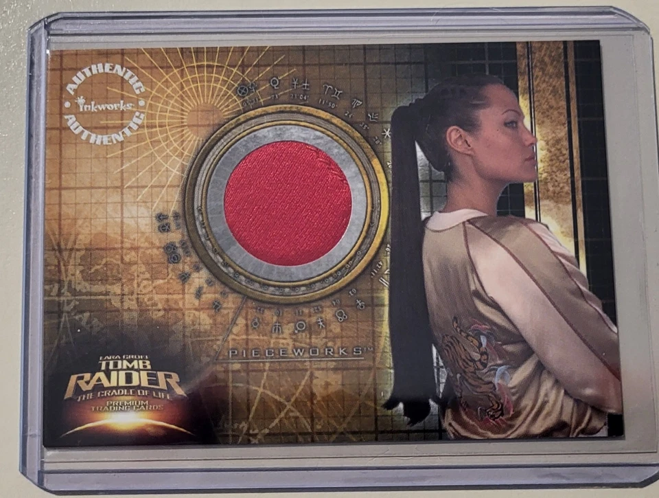 2003 Inkworks Tomb Raider Pieceworks PW1 Angelina Jolie Worn Jacket Red Variant - Image 1 of 1