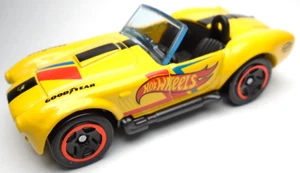 2022 HOT WHEELS SHELBY COBRA 427 S/C YELLOW 1:64 DIECAST 2 5/8" CAR W RED & BLUE - Picture 1 of 6