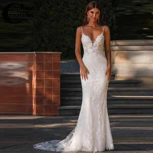 Abito da sposa con spalline spaghetti senza maniche applicazioni in pizzo scollo a V abiti a sirena - Foto 1 di 6