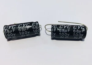 COPPIA CONDENSATORI NON POLARIZZATI  68uF 100v 30X13 mm ELETTROLITICO FILTRI  - Foto 1 di 1