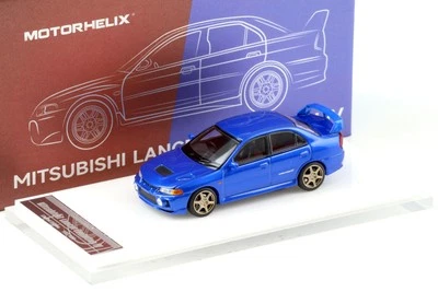 1:64 Motore Elica Mitsubishi Lancer Evolution IV Metallico Blu + Ruote HEC EXPO - Immagine 1 di 4