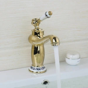 Grifo mezclador montado en cubierta para lavabo de baño de latón y cerámica con acabado dorado - Imagen 1 de 10