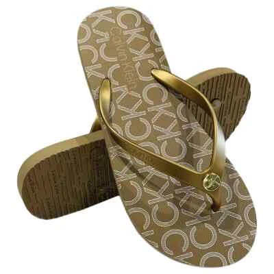MSRP $39.99 NWT CALVIN KLEIN SARMINYA WOMEN'S GOLD FLIP FLOPS SANDALS SIZE 6 7 - Image 1 of 4