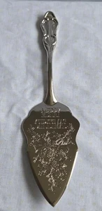 Paleta para servidor de pasteles plateada internacional grabada Feliz Navidad - Imagen 1 de 8