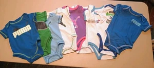 Neun (9) Baby Kurzarm Bodys mit dem Puma Logo Größen 3/6 & 6/9 Monate - Bild 1 von 6