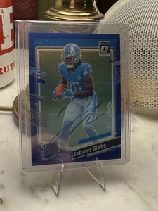 Donruss Optic Jahmyr Gibbs #236 2023 azul novato automático/99 coincidencia de colores - Imagen 1 de 2