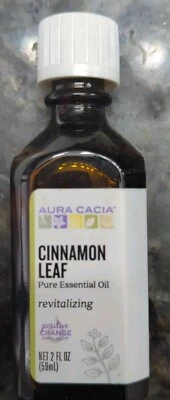 Aceite esencial puro revitalizante de hoja de canela Aura Cacia 2 fl oz botella líquida  Foto 1 de 4