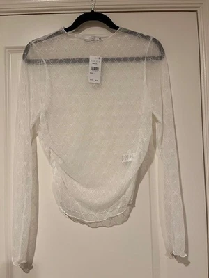 Top para mujer Lush marfil con lazo transparente manga larga cuello falso talla L Foto 1 de 4