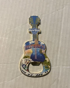 New Hard Rock Guitar Hotel Hollywood FL Magnet Bottle Opener 4.5 Inches Long - Picture 1 of 3