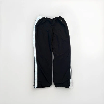 Pantalones deportivos vintage Y2K Nike para hombre joven grandes negros de nailon gimnasio entrenamiento pista Foto 1 de 4