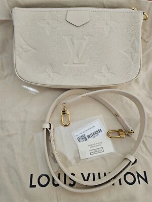 BOLSO DE CUERO LOUIS VUITTON POCHETTE GIGANTE MONOGRAMA MARFIL CREMA EMPREINTE DORADO  Foto 1 de 4