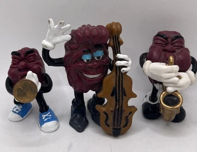 Lote de 3 Figuras De Colección Saxofón Trompeta Music Player California Raisins Años 80 Foto 1 de 4