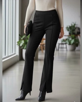 Pantalones elásticos Forever 21 imitación gamuza negros acampanados aberturas delanteras talla XS Foto 1 de 4