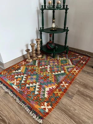 Alfombra Kilim de lana tejida a mano: diseño tribal naranja (0,80 × 1,20 m) Foto 1 de 4