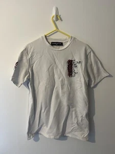 Camiseta Maniere De Voir Gráfica Doble Cara “X” Equipo MDF Unisex Extra Pequeña - Imagen 1 de 14