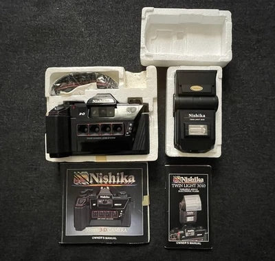 Cámara estéreo 3D Nishika N8000 35 mm y doble luz 3010 en caja manuales Foto 1 de 4