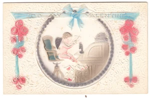 Highly Embossed Cupid at Desk Cuts out Valentine Hearts~Vintage Novelty Postcard - Picture 1 of 2