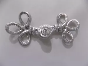 ALAMARO IN PASSAMANERIA CHIUSURA ABBIGLIAMENTO GIACCHE CAPPOTTI LUREX ARGENTO - Foto 1 di 1