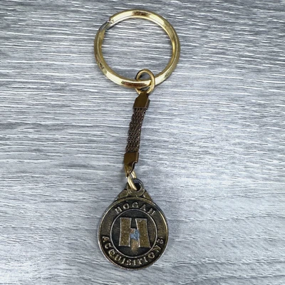 Vintage Keychain HOGAN Acquisitions Key Ring Fob Merger Advertising - Image 1 of 4