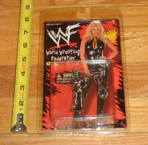 1998 WWF WWE Sable Die Cast Keychain Wrestling Placo Toys MIP Diva Bomb Womens Cover