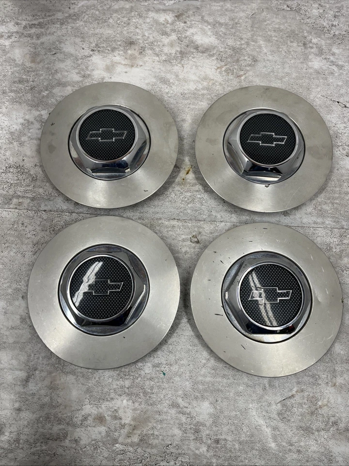 Juego de 4 tapas centrales de rueda Chevrolet Monte Carlo 1998-2007 OEM IMPERFECCIONADAS Foto 1 de 4