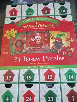 Eurographics puzzles;  Christmas Dogs Advent Calendar;  24 puzzles w/ 50 pcs ea. - Image 1 of 4