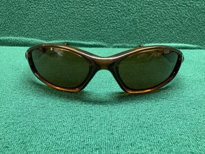 Oakley Minute 2.0 Marco Ámbar Oscuro Lente Bronce Oscuro Iconos Dorados 04-516 RARO Foto 1 de 4