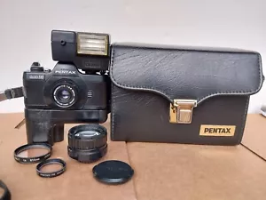 Fotocamera Asahi Pentax Auto 110 con obiettivi 24mm 50mm e custodia - Foto 1 di 24