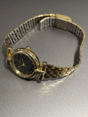 Reloj Mujer Nelsonic Acero Inoxidable Dorado Resistente al Agua Batería Cuarzo Negro Foto 1 de 4