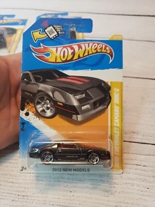 HOT WHEELS 2012 NEW MODELS 1985 CHEVROLET CAMARO IROC-Z  NEW Black, Red Stripe - Picture 1 of 8