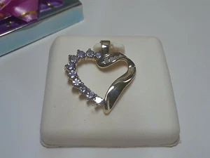 Herzanhänger 0,44 kt natürlicher Tazanit & Diamant poliert 10 kt Gelbgold #13651 - Bild 1 von 4