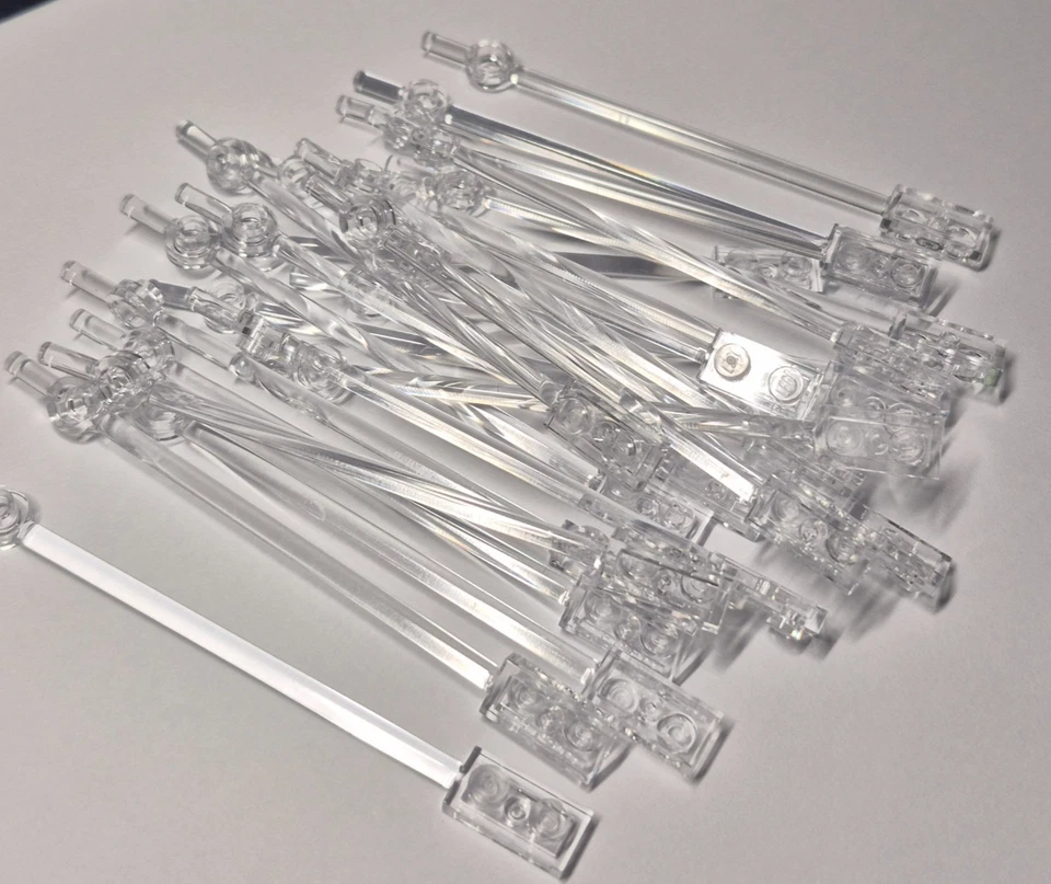 Lego 42445/99784 Bar 1x12 with 1x2 Plate End Round Trans Clear Pack of 10 NEW. - Image 1 of 1