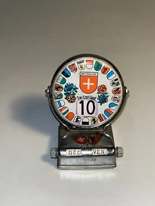 Calendrier perpetual vintage en métal Suisse - Foto 1 di 8
