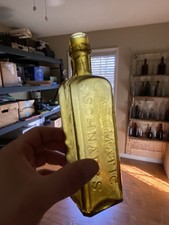 New ListingUdolpho Wolfe’s Schiedam Aromatic Schnapps Bottle, Olive Green Honey Amber