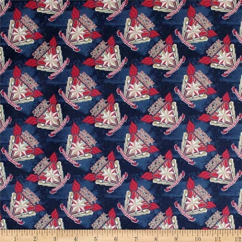 Avengers, Captain Marvel Logo on Blue, 100% Cotton fabric by the yard - Image 1 of 1