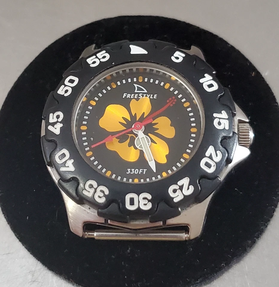 Reloj FREESTYLE Mujer Analógico Esfera Negra Flor Naranjo Resistente al Agua 31 mm Foto 1 de 1