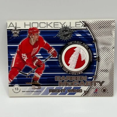 2000-01 Pacific Vanguard Dual Game Worn Patches Byron Dafoe/Darren McCarty /300 - Image 1 of 2