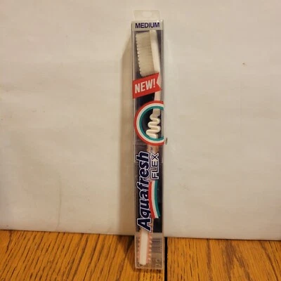 Cepillo de dientes flexible Aquafresh vintage de principios de los 90 Alemania estuche rígido sellado rosa Foto 1 de 4