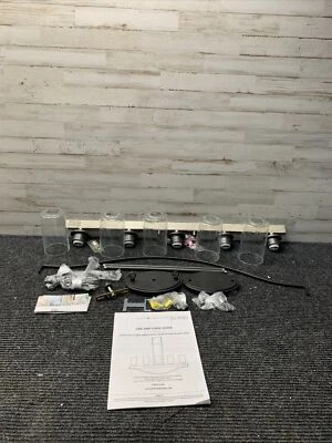 Lámpara de araña lineal Prescott de 5 luces de hierro yunque de una fila con vidrio transparente de semillas Foto 1 de 4