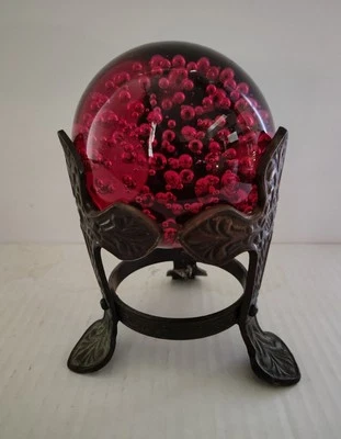 Glass Paperweight Ruby Red Ball Controlled Bubbles In Brass Ornate Cross Stand  - Image 1 of 4